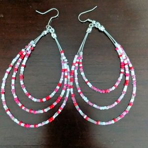 Large pink beaded earrings